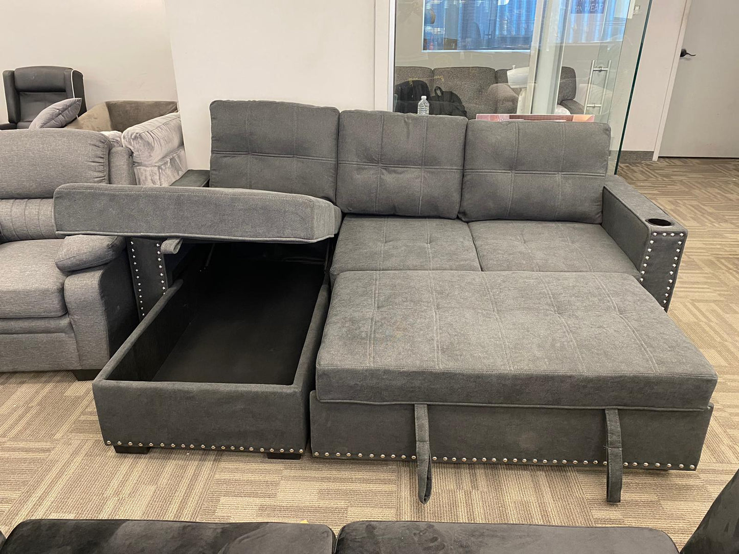 (401 NH MCDONALDS CHARCOAL GREY)- REVERSIBLE- FABRIC SECTIONAL SOFA- WITH PULL OUT BED